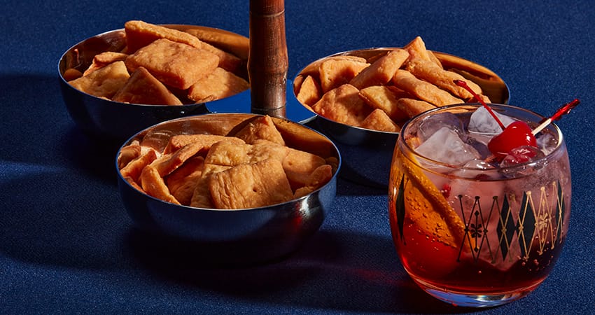 cheddar goat cheese crackers with an old fashioned drink